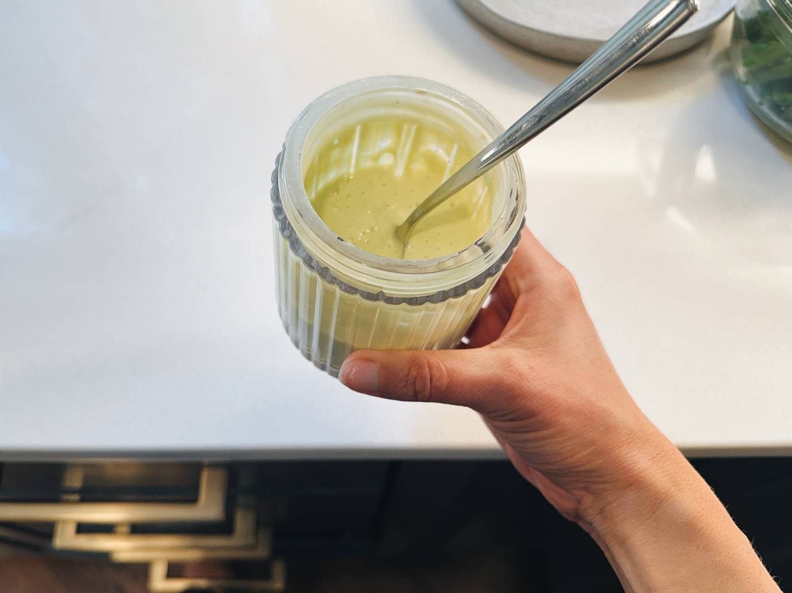 Avocado caesar dressing in a blender.