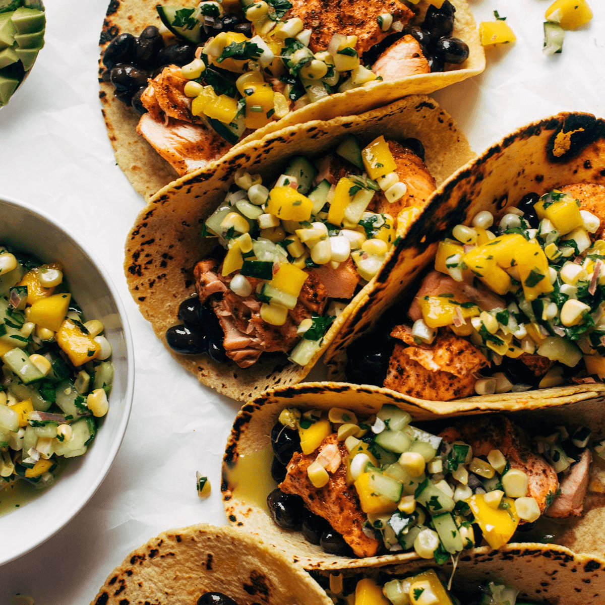 Salmon tacos with salsa.