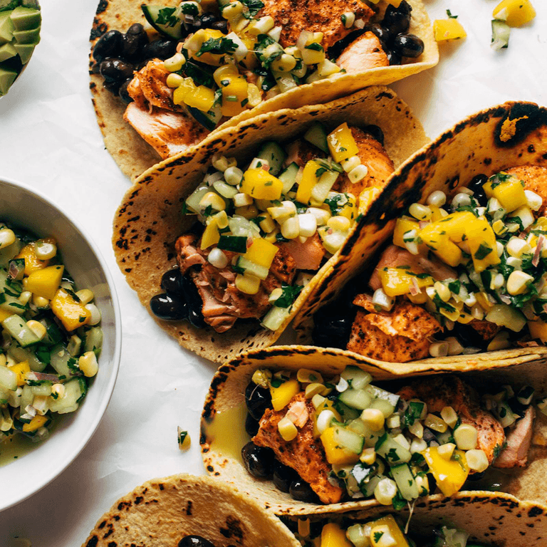 Salmon tacos with salsa.