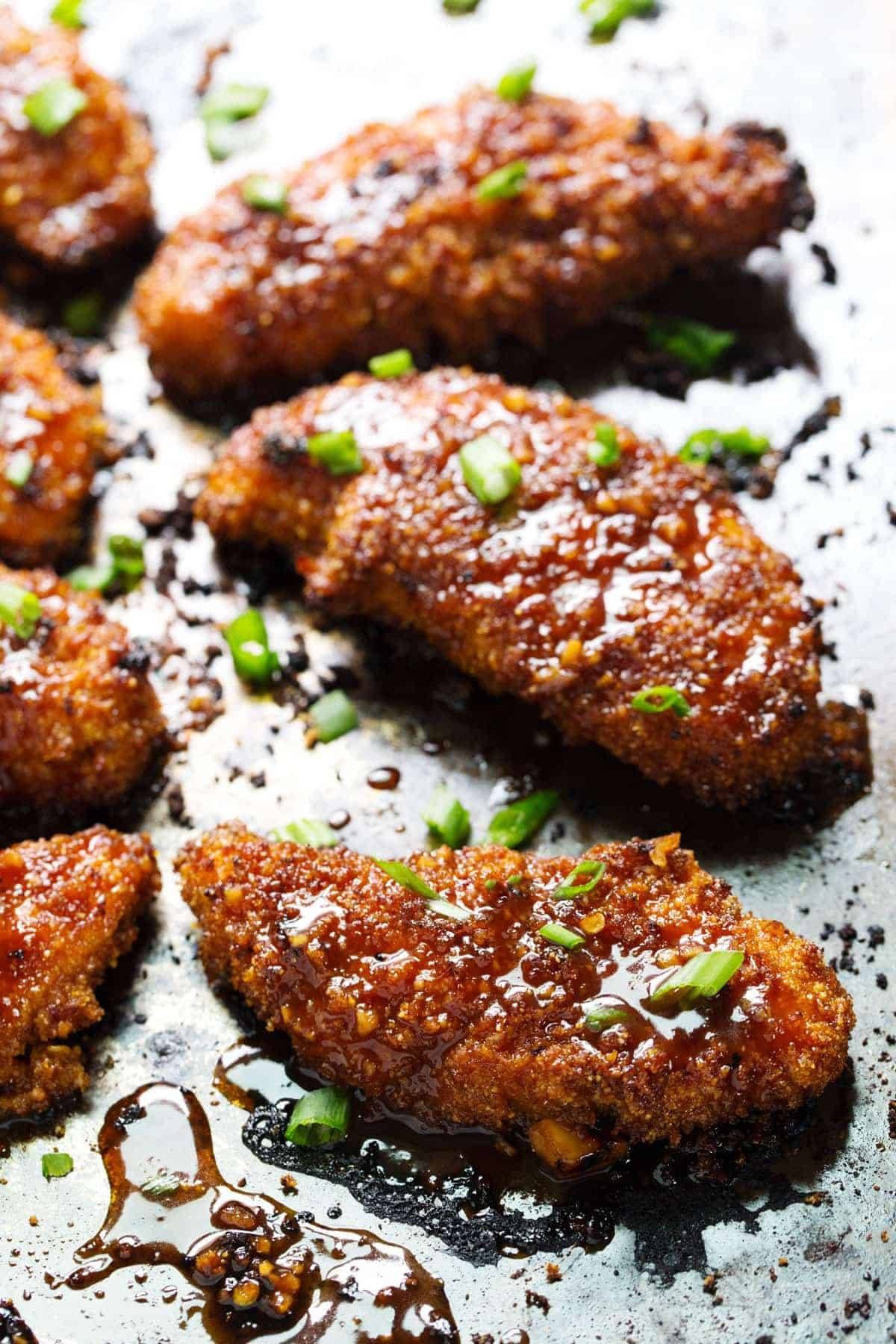 Sticky Garlic Chicken with green onions.